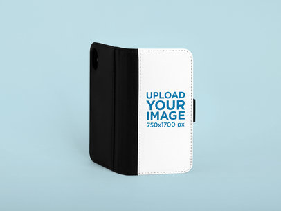 Mockup of an iPhone XS Wallet Case Standing Against a Plain Background 29227