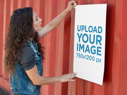 Poster Mockup of a Woman Taping a Poster to a Container