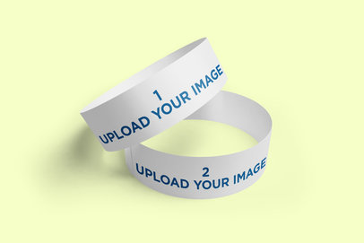 Mockup of an Event Paper Wristband on Top of Another One