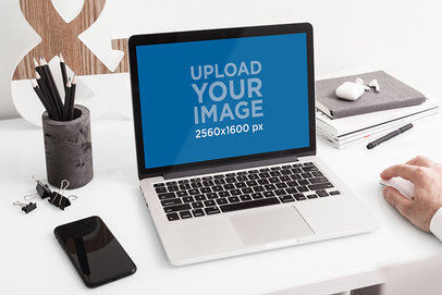 MacBook Pro Mockup Featuring an Elegant Desk