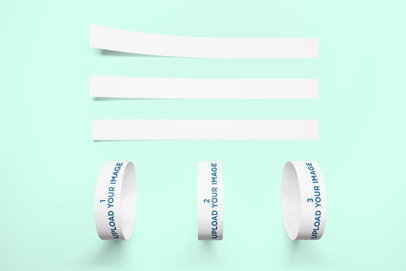 Mockup of Three Event Wristbands Against a Minimalist Surface