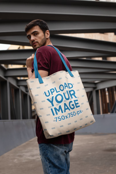 Mockup Featuring a Bearded Man Carrying a Tote Bag with Customizable Straps on His Shoulder