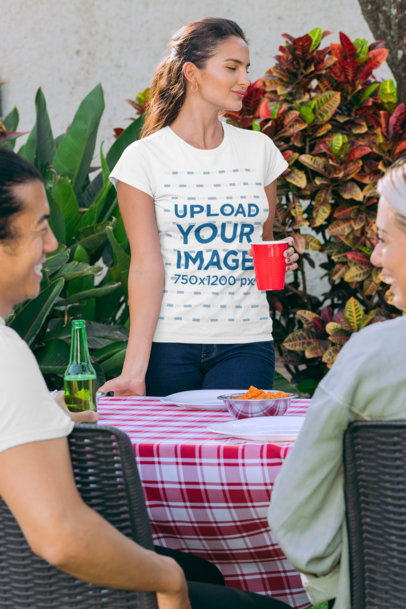 T-Shirt Mockup Featuring a Woman Drinking from a Red Cup at a BBQ Party 29705
