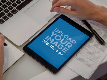  Mockup of an iPad Featuring a Man Working