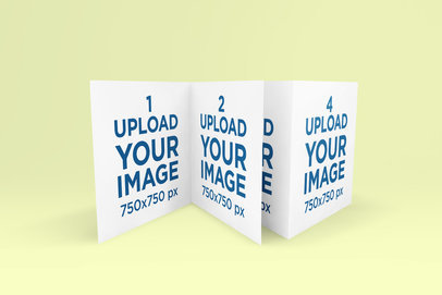 Mockup Featuring Two Square Greeting Cards Standing Against a Colored Background