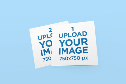 Mockups Featuring Two Greeting Cards Lying on a Solid Color Surface