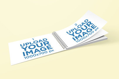 Mockup of a Spiral Bound Book with Flying Pages