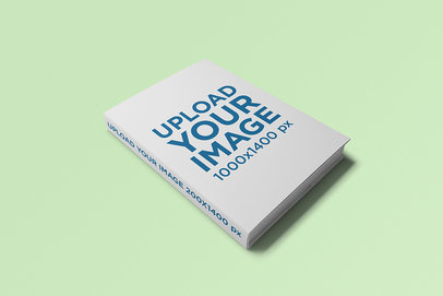 Mockup of a Hard Cover Book in a Plain Color Surface