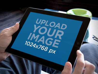 Mockup of a Business Man Holding an iPad in Landscape Position 
