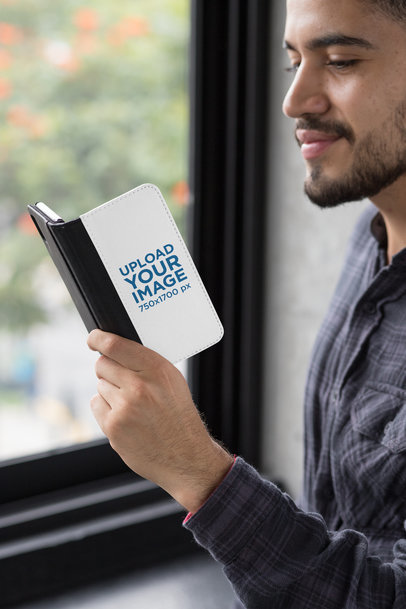 Wallet Case Mockup of an iPhone X Featuring a Man Smiling 29820