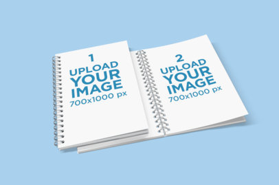 Mockup of Two Spiral Notebooks Placed on a Colored Surface 