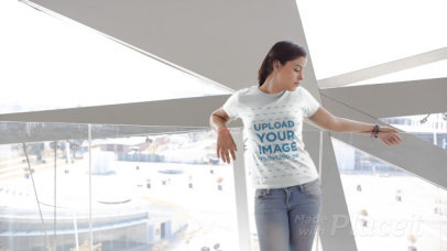 T-Shirt Video of a Smiling Woman in Front of a Glass Wall