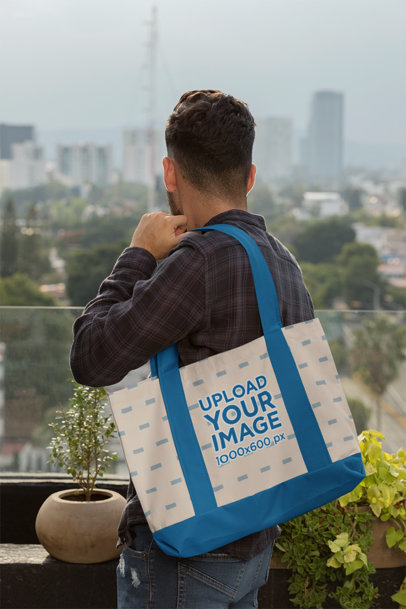Weekend Bag Mockup of a Man in a Terrace 