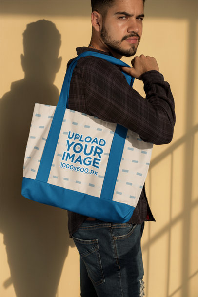 Mockup of a Man Holding a Weekend Bag 29797