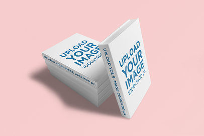 Hard Cover Book Mockup Featuring a Pile of Books in a Solid Color Backdrop