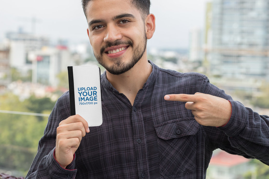 Mockup of a Man Pointing at His Wallet Case for iPhone 11