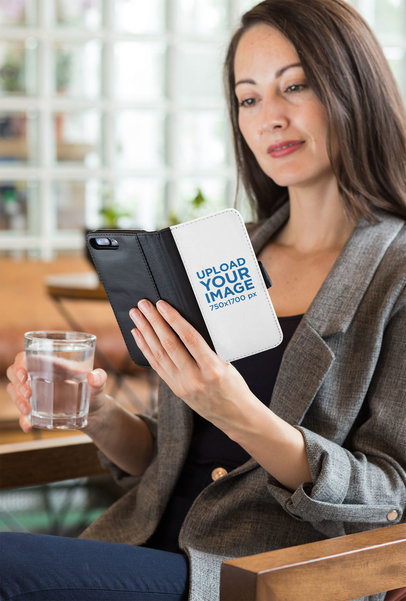 Wallet Case Mockup of a Woman at a Restaurant Looking into Her iPhone 8 Plus 29803