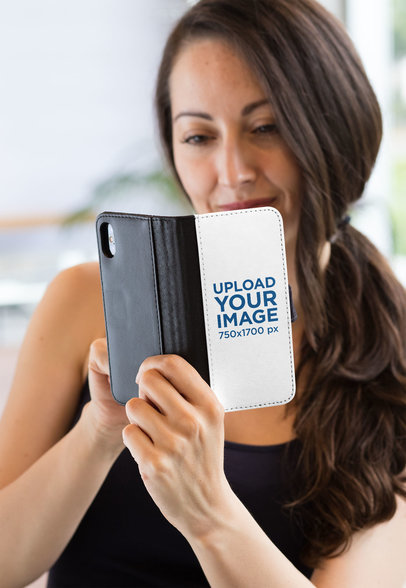 Wallet Case Mockup of a Woman Scrolling Through Her iPhone X 29811