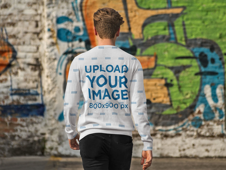 Back of a Man Wearing a Crewneck Sweater Mockup Walking to a Graffiti