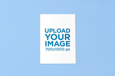 Mockup of a Magazine Against a Solid Color Backdrop 