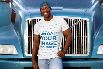T-Shirt Mockup of a Man Leaning Against a Blue Truck 