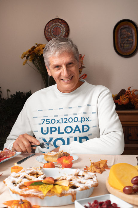 Sweatshirt Mockup Featuring a Senior Man at a Thanksgiving Dinner 