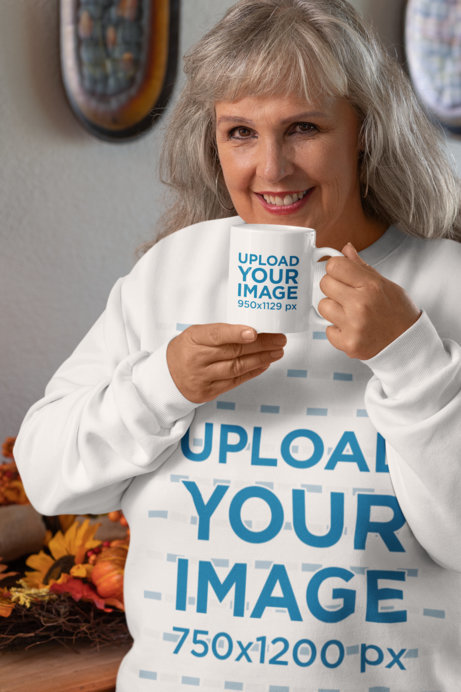Mockup of an Elderly Woman with a Sweatshirt Sipping from an 11 oz Coffee Mug