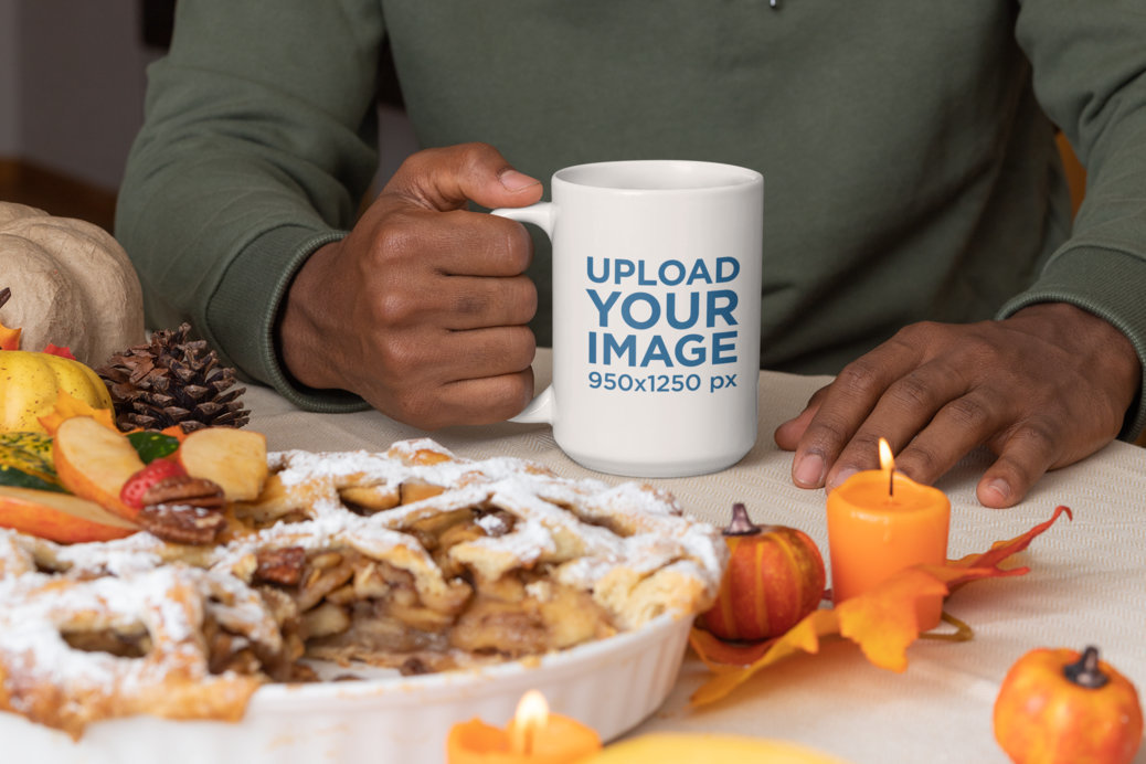 Mockup of a Man Holding a 15 oz Mug at a Thanksgiving Party