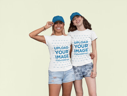 Mockup of Two Friends Wearing Matching T-Shirts at a Studio