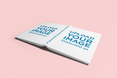 Hard Cover Book Mockup Featuring an Open Book Lying Face Down