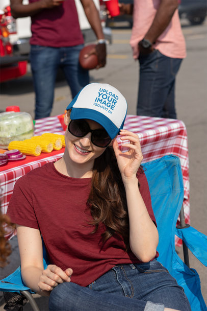 Trucker Hat Mockup of a Woman at a Tailgate Party