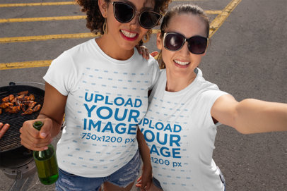 T-Shirt Mockup of Two Friends at a Tailgate Party 