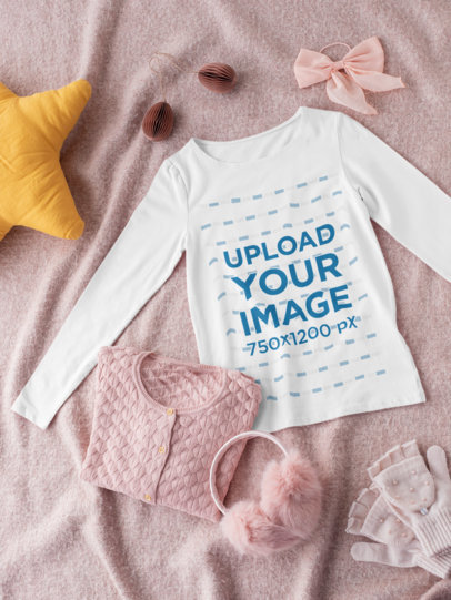 Mockup of a Long Sleeve Tee for a Girl Lying on a Textured Surface 