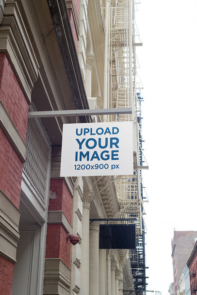 Mockup of a Shop Sign at a Fancy Street