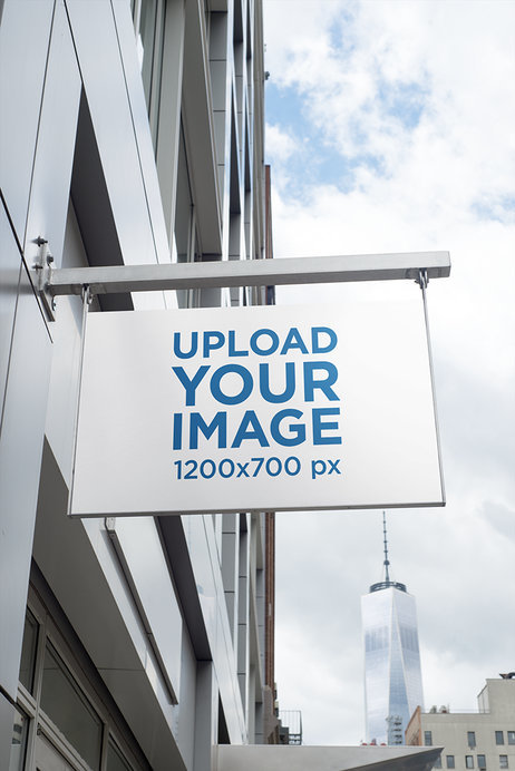 Store Sign Mockup in a City Scenario Featuring a Building in the Background