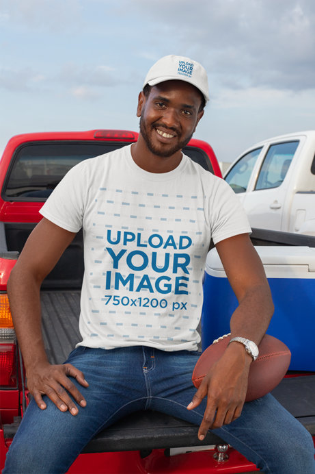 Dad Hat Mockup of a Man Wearing a T-Shirt and Holding a Football