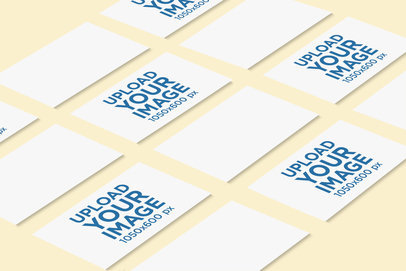 Mockup of Several Business Cards Lying on a Colored Surface 