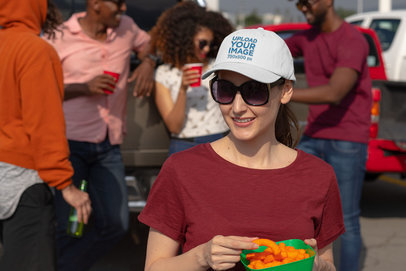 Mockup of a Woman at a Tailgate Party Wearing an Embroidered Dad Hat