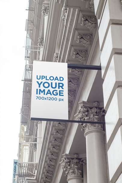 Mockup of a Vertical Shop Sign on an Elegant Building
