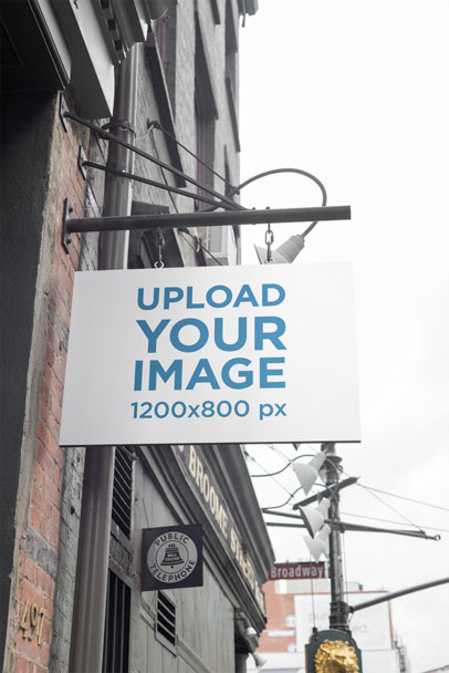 Mockup of a Shop Sign on a Brick-Wall Building