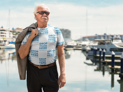 T-Shirt Mockup of a Man Standing on a Deck at the Marina a10932