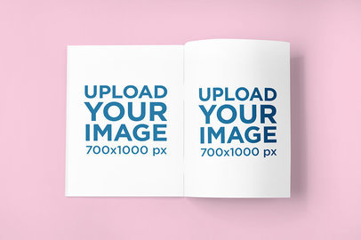 Magazine Mockup Featuring a Spread Magazine on a Colored Surface