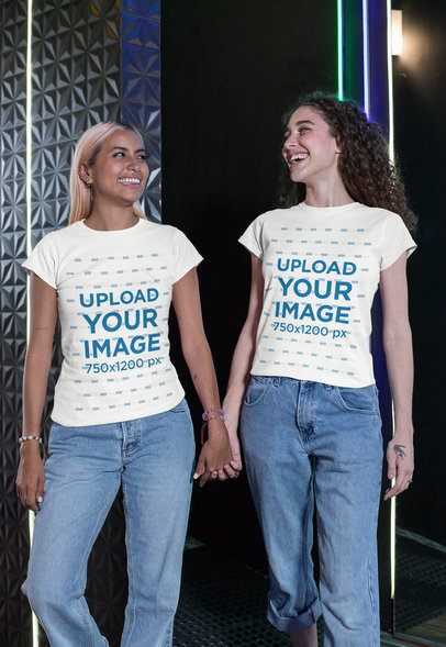 Mockup of Two Friends Wearing Matching Tees and Holding Hands