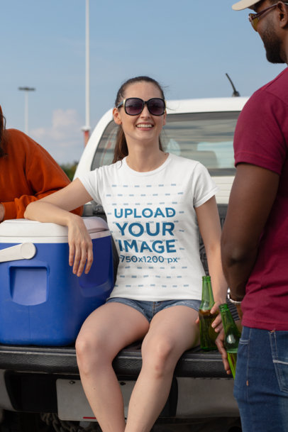 Mockup of a Woman Wearing a Crewneck T-Shirt and Having Fun at a Tailgate
