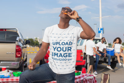 T-Shirt Mockup of a Man Eating at a Tailgate Party