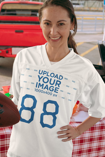 Mockup of a Woman with an Oversized Jersey at a Tailgate Party 29902