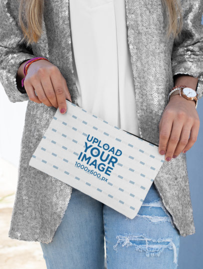 Mockup of a Stylish Woman Holding a Pouch