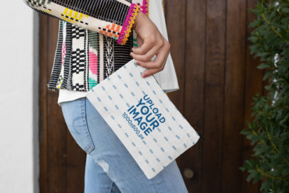 Mockup of a Woman Holding a Sublimated Pouch