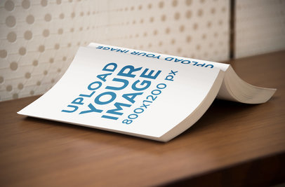 Mockup of an Open Digest Size Book Lying Facedown on a Desk