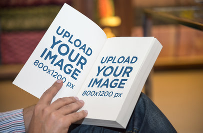 Mockup of a Man Showing the First Interiors of a Digest Size Book 
